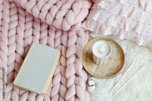 Cup with cappuccino, pink pastel giant plaid, fur, bedroom, morning concept