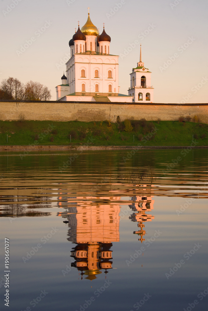 Trinity Cathedral with reflection in the rays of the evening sun. The Pskov Kremlin, Russia