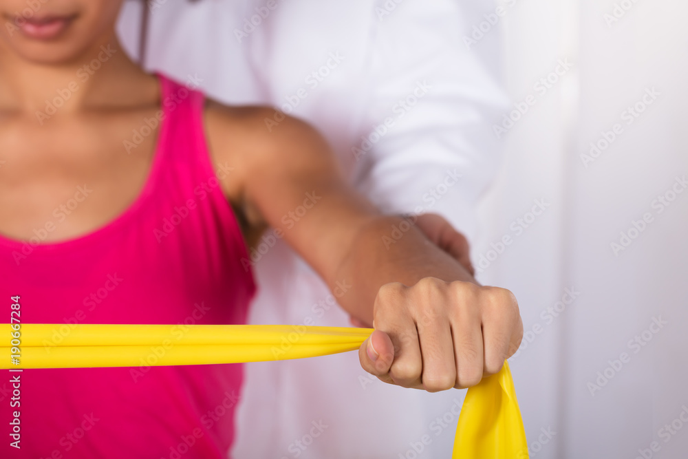 Woman Exercising With Exercise Band Woman Exercising With Exercise Band