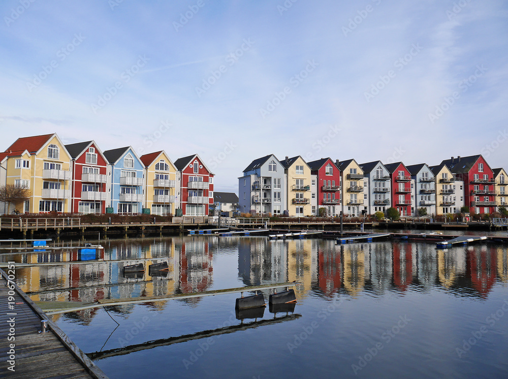 Colorful houses by the cold water and blue sky in Germany - obrazy, fototapety, plakaty 