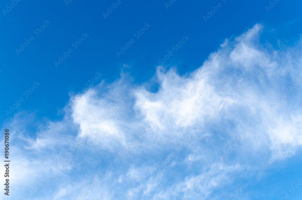 Fototapeta premium Blue skies wiht white clouds background.