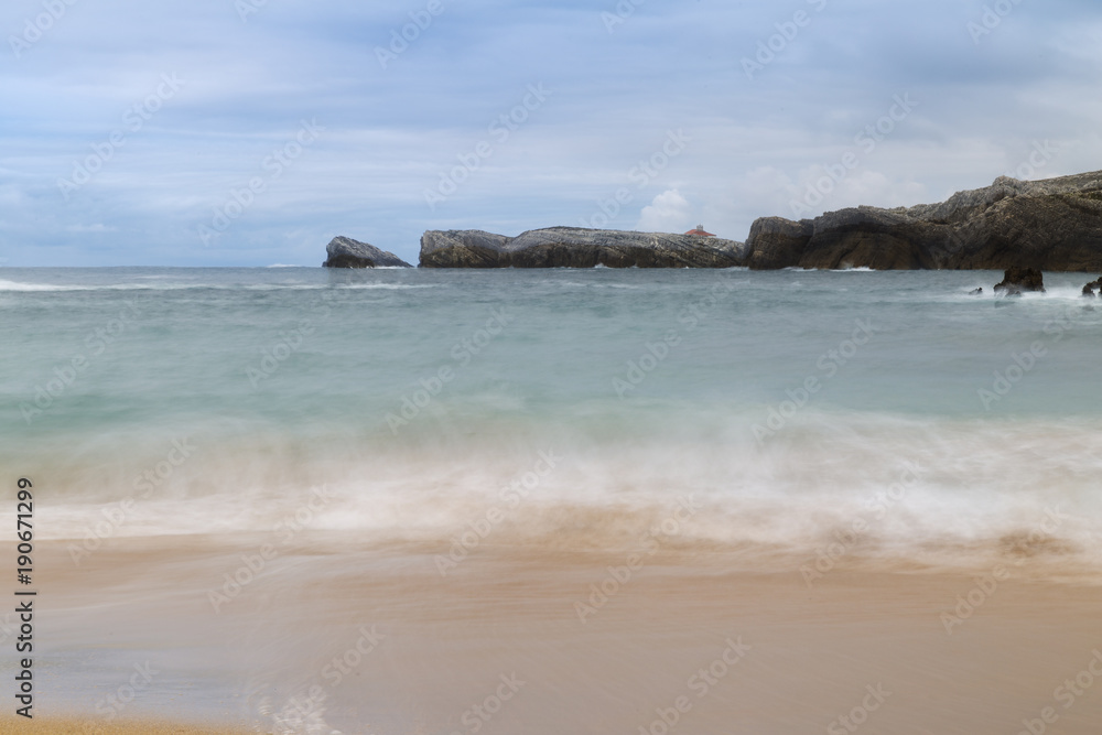 beautiful beach with waves breaking on the shore and without people
beautiful beach with waves breaking on the shore and without people