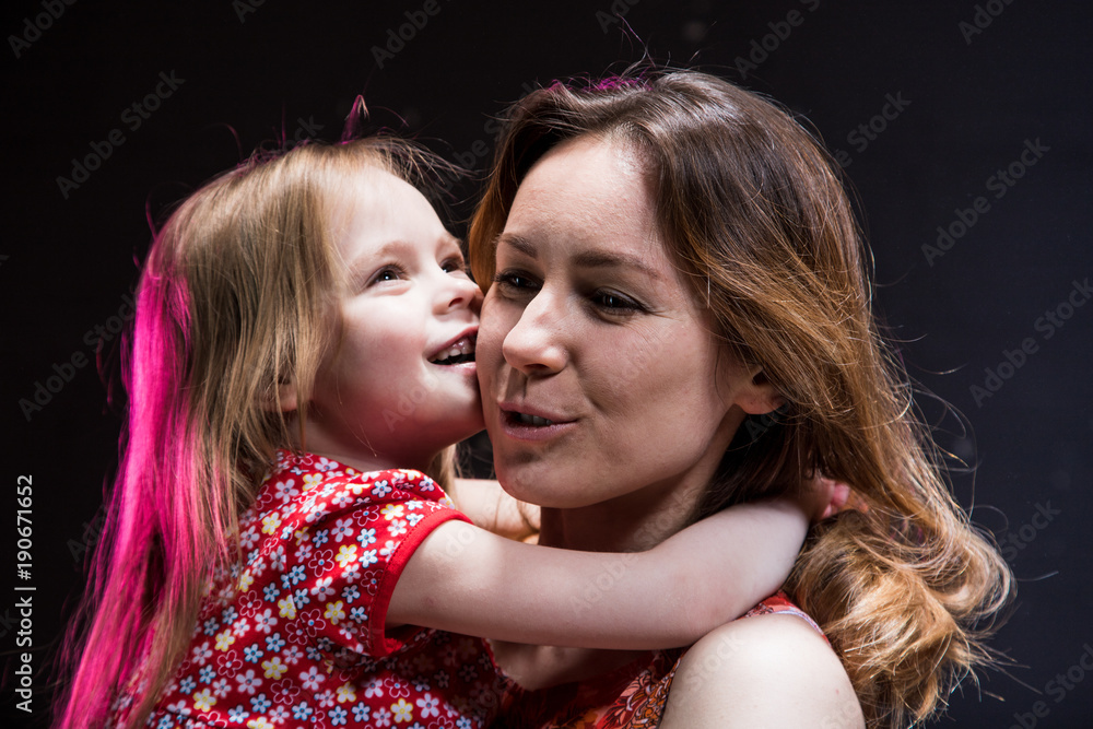 Portraits of young mother and small daughter during photoshoot Portraits of young mother and small daughter during photoshoot