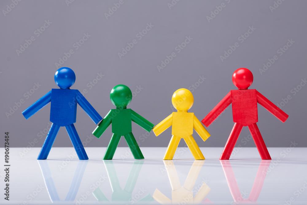 Multi Colored Human Figures Standing In A Row Multi Colored Human Figures Standing In A Row