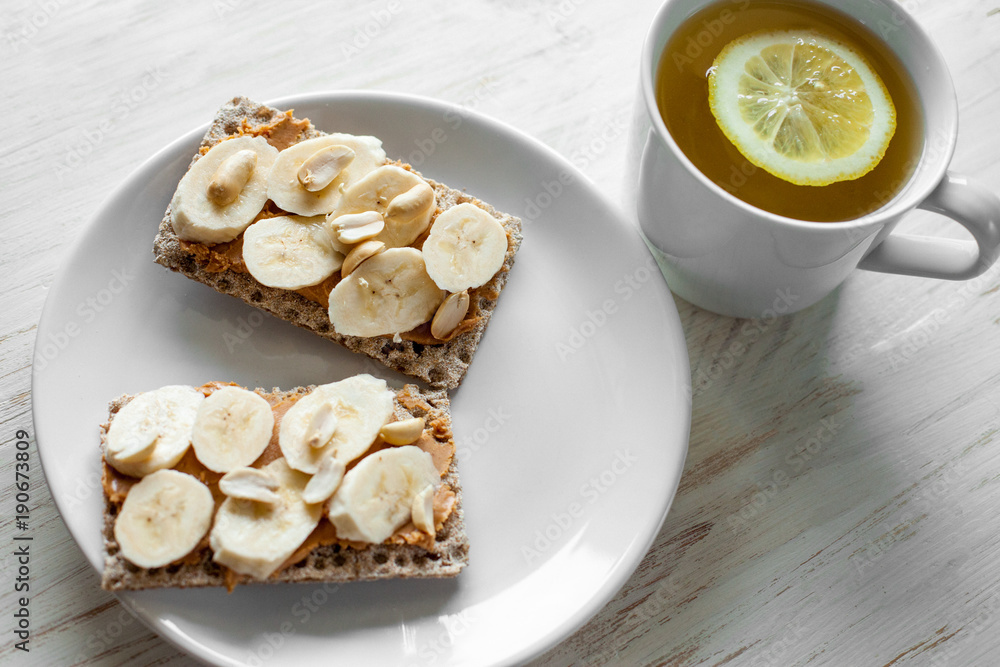 Healthy snack - vegetarian bread loaf with peanut butter and banana Healthy snack - vegetarian bread loaf with peanut butter and banana