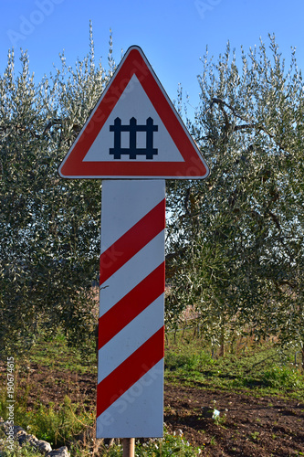  level crossing signpost in a country road.