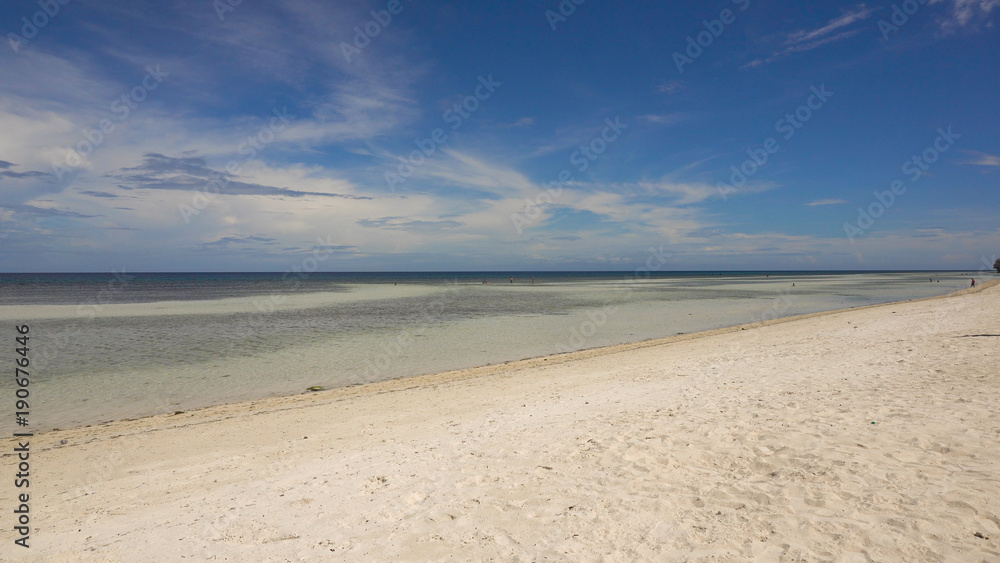 Tropical beach with white sand with beach house on a tropical island Bohol . Beautiful sky, sea. Seascape: Ocean and beautiful beach paradise. Philippines. Travel concept.