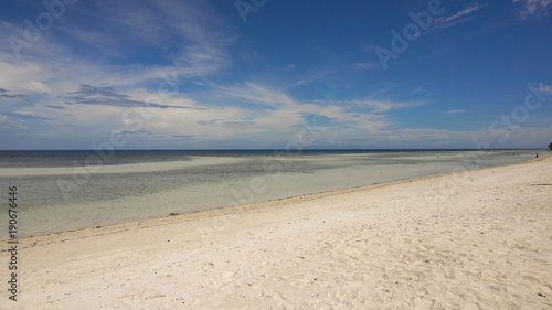 Tropical beach with white sand with beach house on a tropical island Bohol . Beautiful sky  sea. Seascape  Ocean and beautiful beach paradise. Philippines. Travel concept.