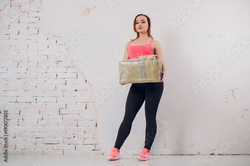 Fitness sport girl in fashion sportswear doing yoga fitness exercise in the street, outdoor sports, urban style photo