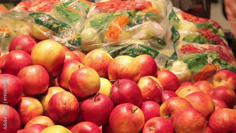 Choosing and buying apples at the store Choosing and buying apples at the store
