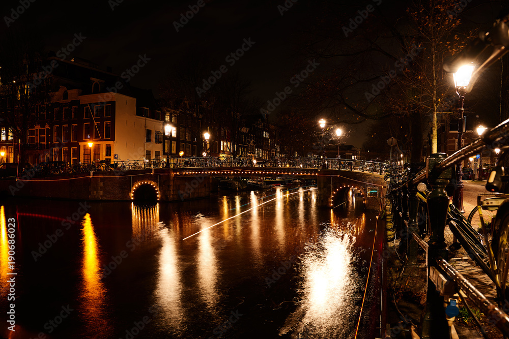 Beautiful Amsterdam city at the evening time. Amsterdam, Netherlands.