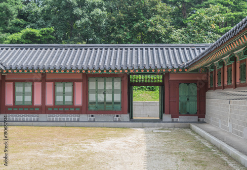 Colorful building with tiled roof and a big courtyard, at Gyeongbokgung Palace, Seoul, South Korea