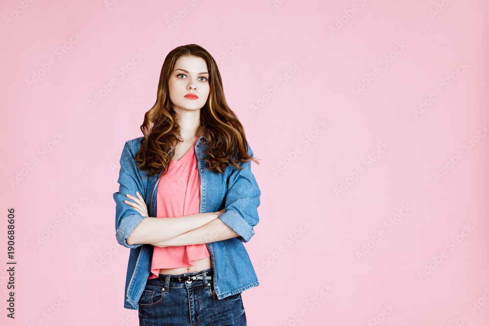 body language and emotions. Studio shot of happy young fair-haired woman  dressed casually jeans and pink t-shirt. pink background. girl poses and  standing with folded  space Stock Photo | Adobe Stock