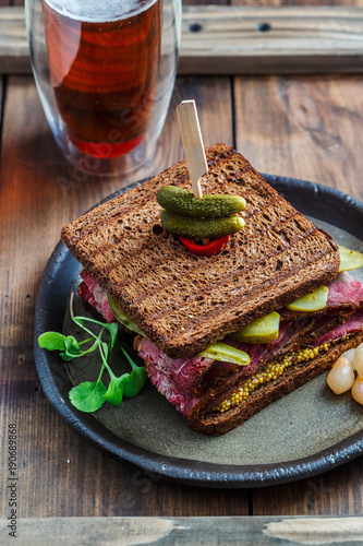 Pastrami sandwich with beer photo