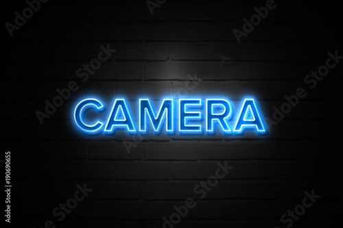Camera neon Sign on brickwall