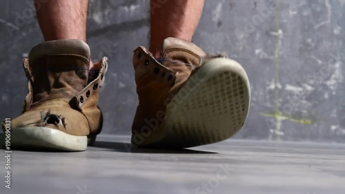 Poverty. Old shoes with hole and toes sticking out