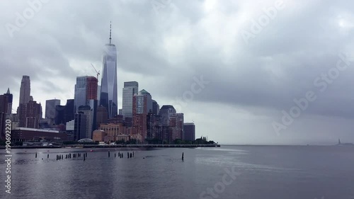 Scenic summer timelapse view of summer clouds moving across the skyscraper skyline of downtown Manhattan and the Hudson River in New York City