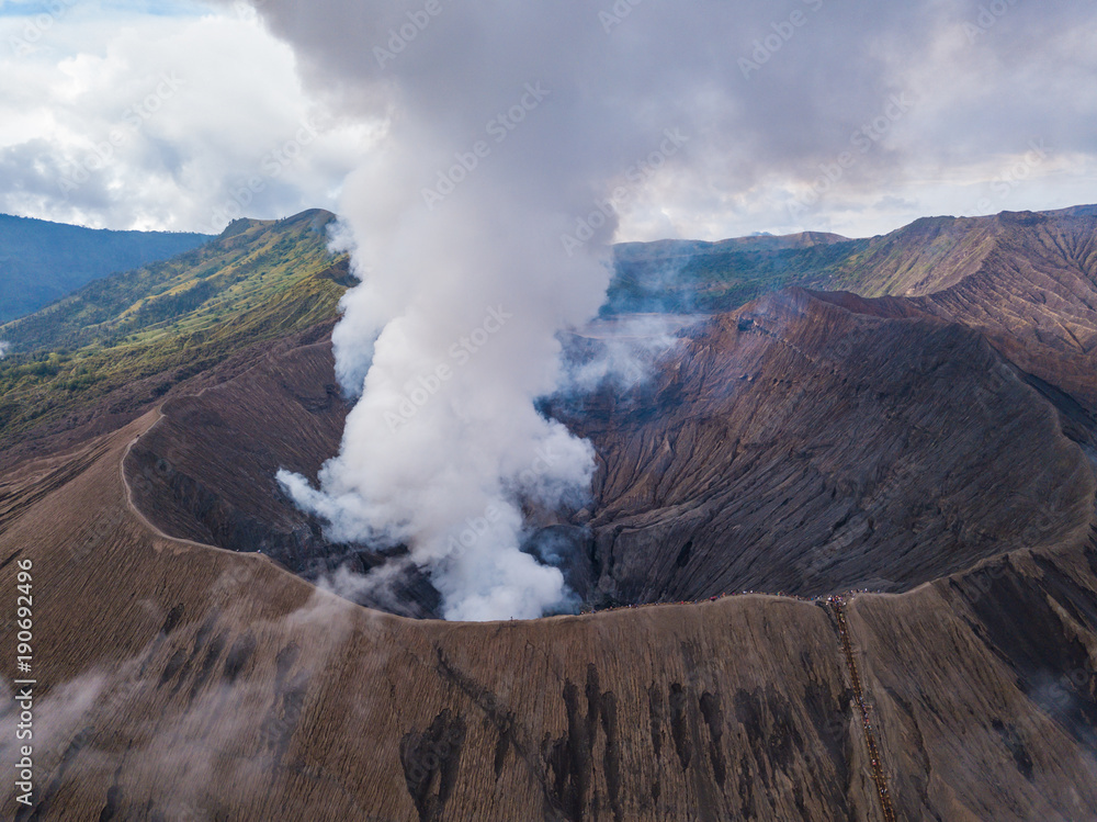 Aerial view to Bromo crater with active volcano smoke in in Bromo Tengger Semeru National Park, East Java, Indonesia.
