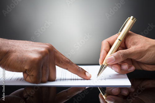 Person Signing On Document