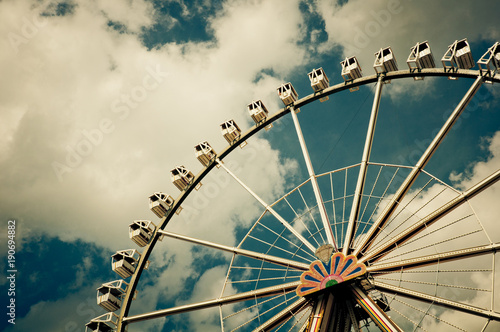 big wheel in front of beautiful sky in summer on a funfair