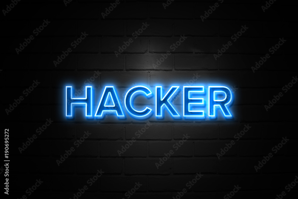 Hacker neon Sign on brickwall