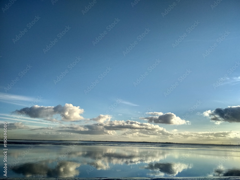 Reflections in the water on a sunny day at Wilhelmshaven Beach, Suedstrand Reflections in the water on a sunny day at Wilhelmshaven Beach, Suedstrand
