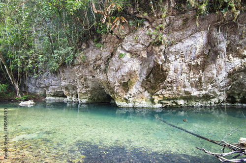 The Bladen River flows under limestone cliffs in one of the most biodiverse and untouched pieces of land in Central America. Photographed in central Belize.