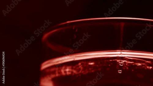 Glass Cup with ice and soda. Smooth rotation. photo