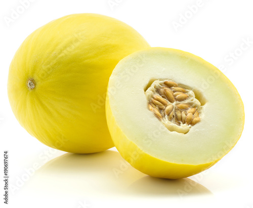 Fotografie, Obraz Yellow honeydew melon and one half with seeds isolated on white background