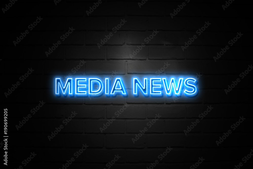 Media News neon Sign on brickwall