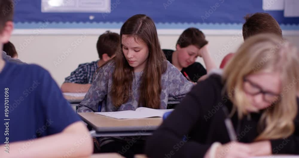 4k, School girl caught cheating using internet during her exam. Slow motion. 4k, School girl caught cheating using internet during her exam. Slow motion.