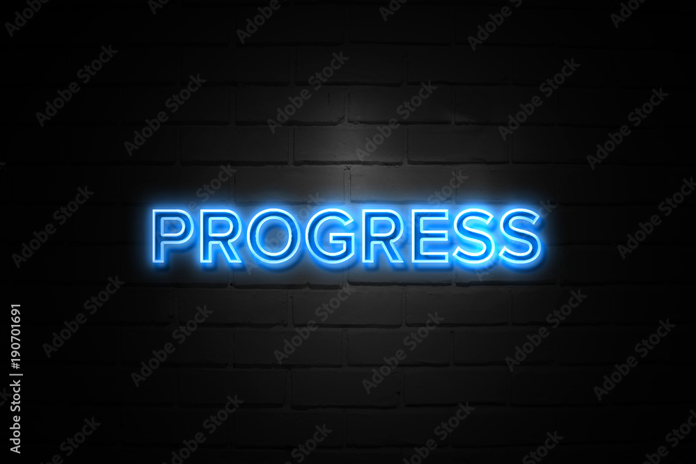 Progress neon Sign on brickwall Progress neon Sign on brickwall
