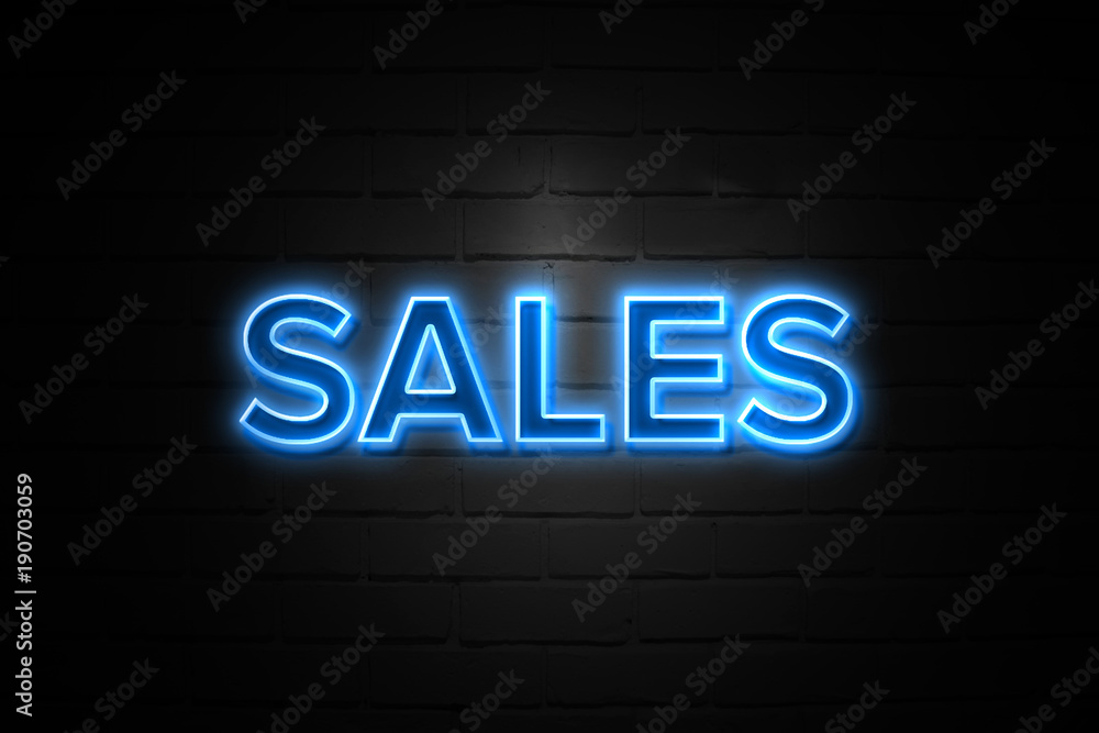 Sales neon Sign on brickwall