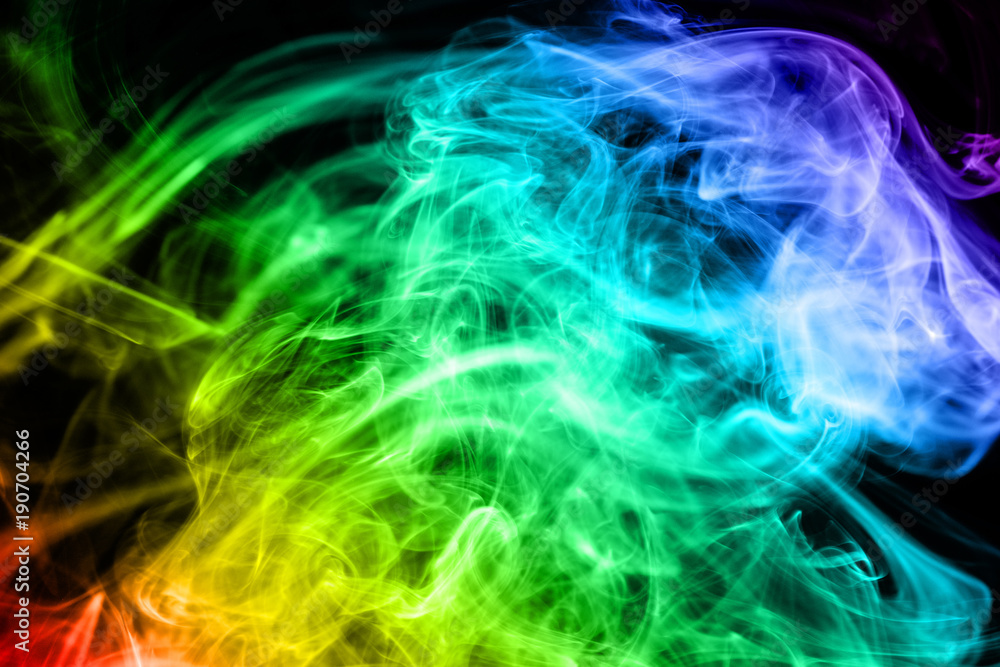 Abstract gradient colored smoke isolated on a black background for your design.