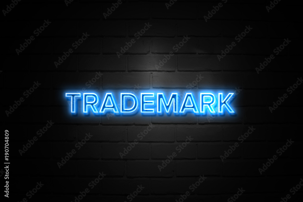 Trademark neon Sign on brickwall Trademark neon Sign on brickwall