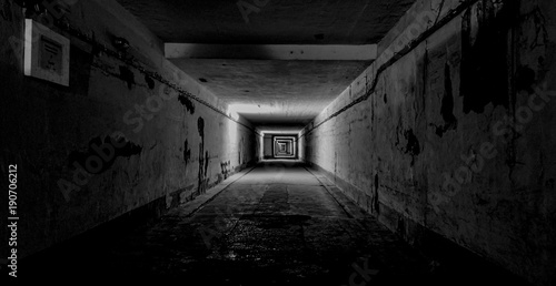 Dark Underground Tunnel with Lights Creating Depth photo