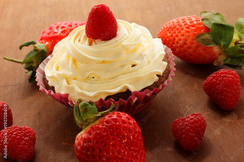 Homemade delicious chocolate cupcakes with fresh raspberry and cream on top. Delicious cupcake for Valentine’s Day.
Homemade delicious chocolate cupcakes with fresh raspberry and cream on top. Delicious cupcake for Valentine’s Day.