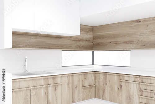 White kitchen corner, wooden countertops close up