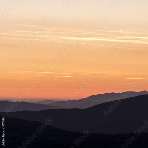 layers of mountains at golden hour © photonik87