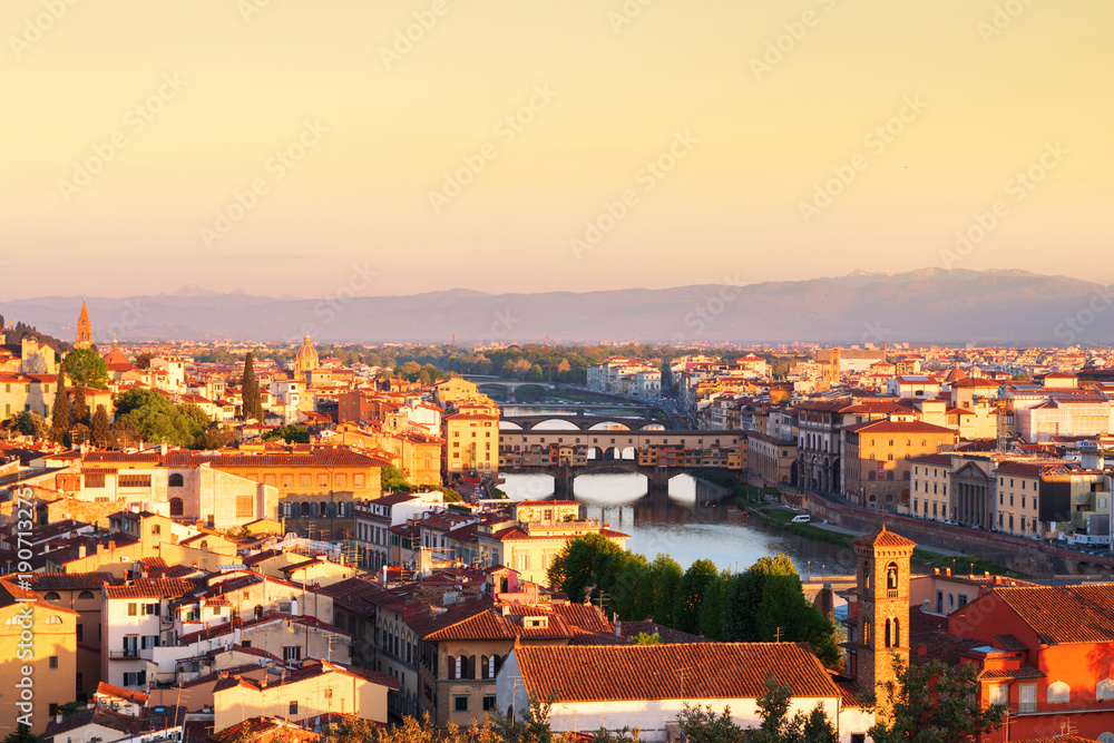 Beautiful views and peace of Florence cityscape in the background Ponte Vecchio bridge at sunrise