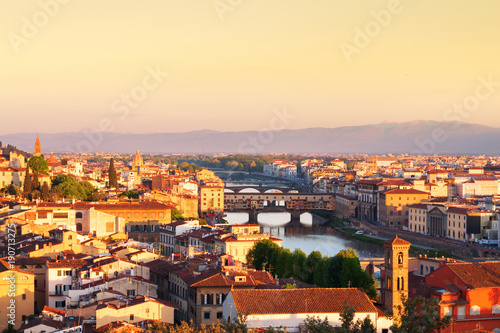 Beautiful views and peace of Florence cityscape in the background Ponte Vecchio bridge at sunrise