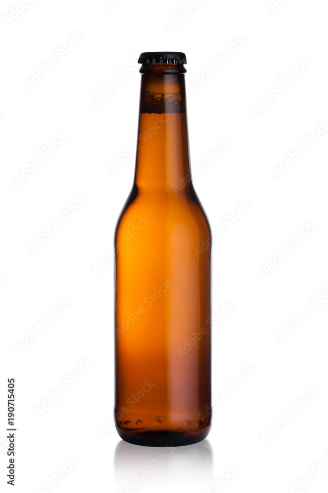 Brown glass beer bottle with black cap isolated