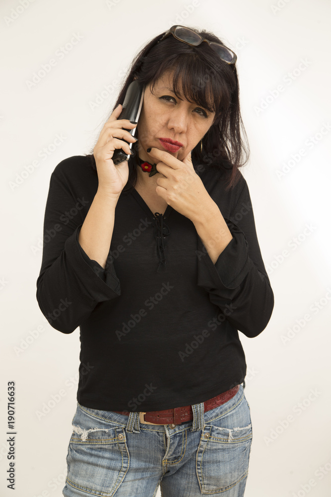 brunette woman talking on cell on white background with kind and happy attitude brunette woman talking on cell on white background with kind and happy attitude