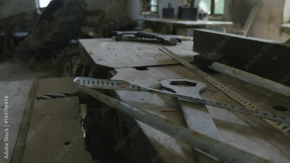 Dusty cluttered work surface, workbench in the workshop. Old machine
Dusty cluttered work surface, workbench in the workshop. Old machine