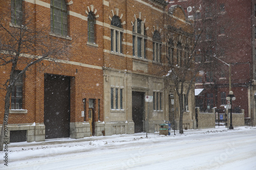 Snow street with old buildings