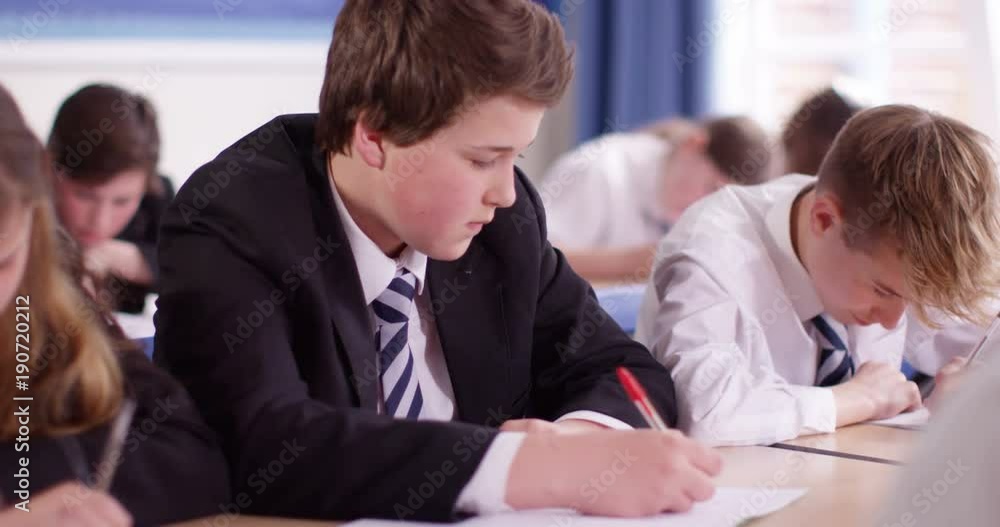 4K Disruptive boys in school classroom pushing each other & causing trouble. 4K Disruptive boys in school classroom pushing each other & causing trouble.