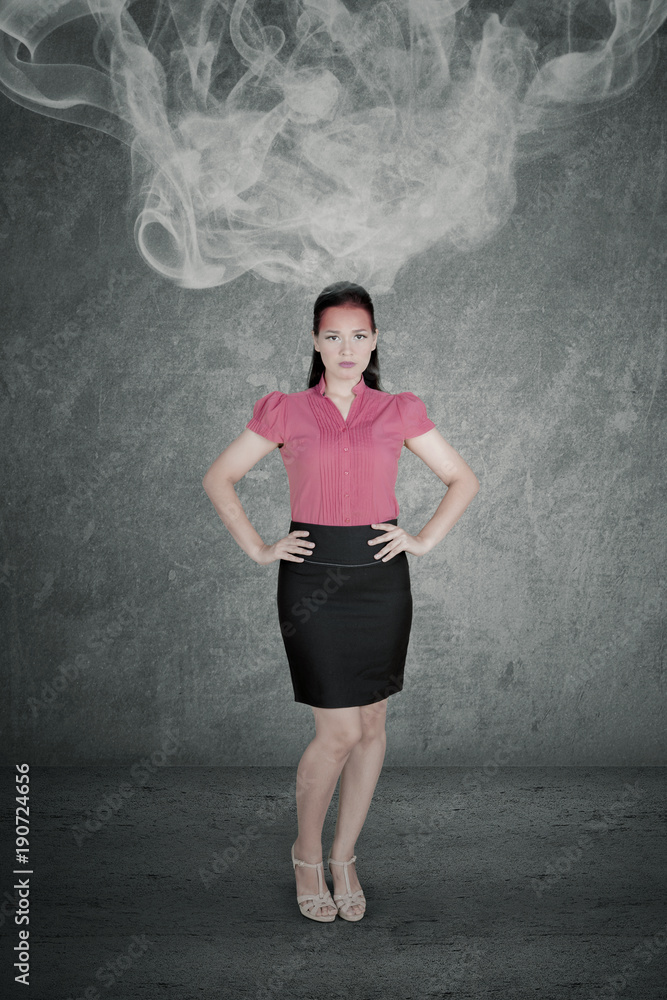 Arrogant businesswoman with smoke over her head