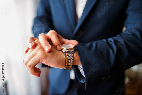 A man looks at what time on their clocks