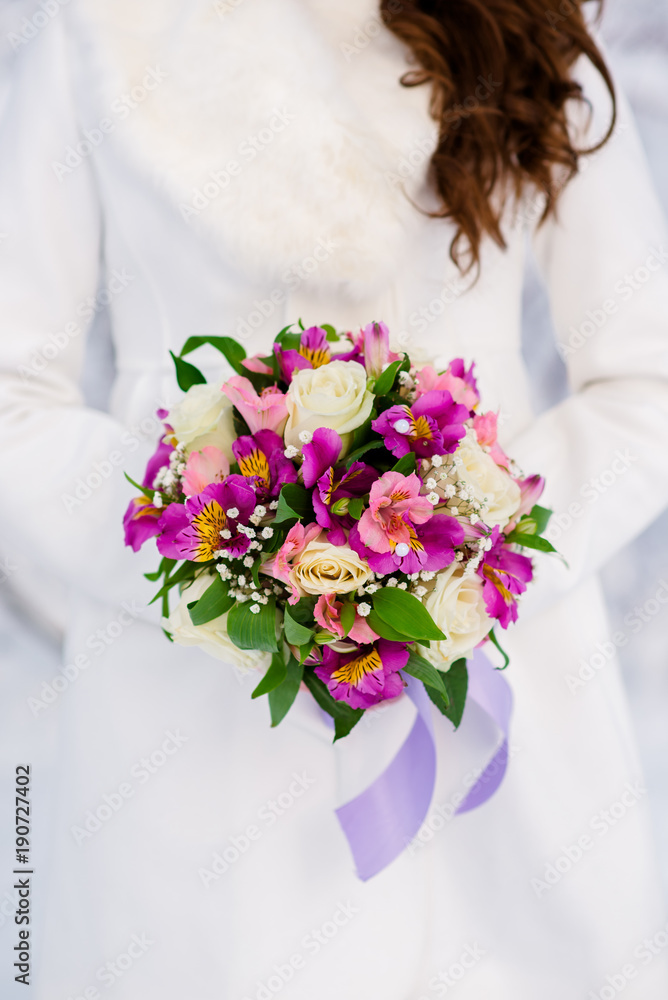 Hands of the bride and the bridal bouquet. Hands of the bride and the bridal bouquet.