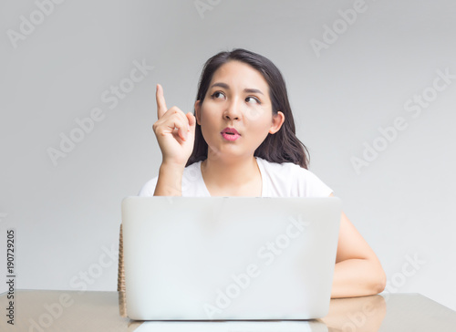 asian woman point to blank laptop screen to display photo